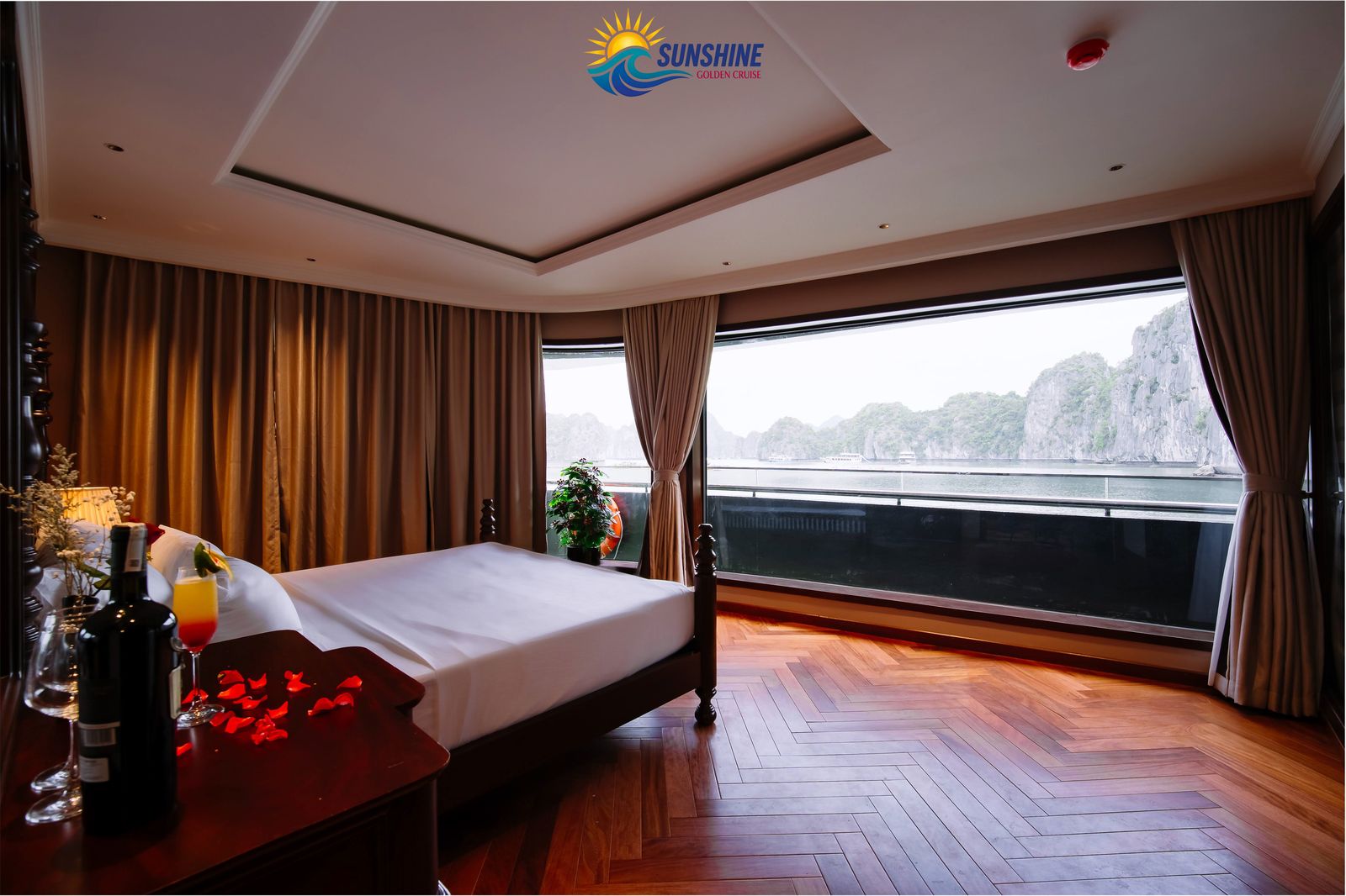 Suite cabin with king bed, welcome cocktail and panoramic bay windows