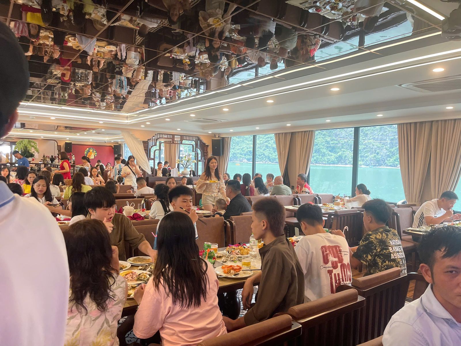 Guests enjoying a lively seafood dinner in the dining hall